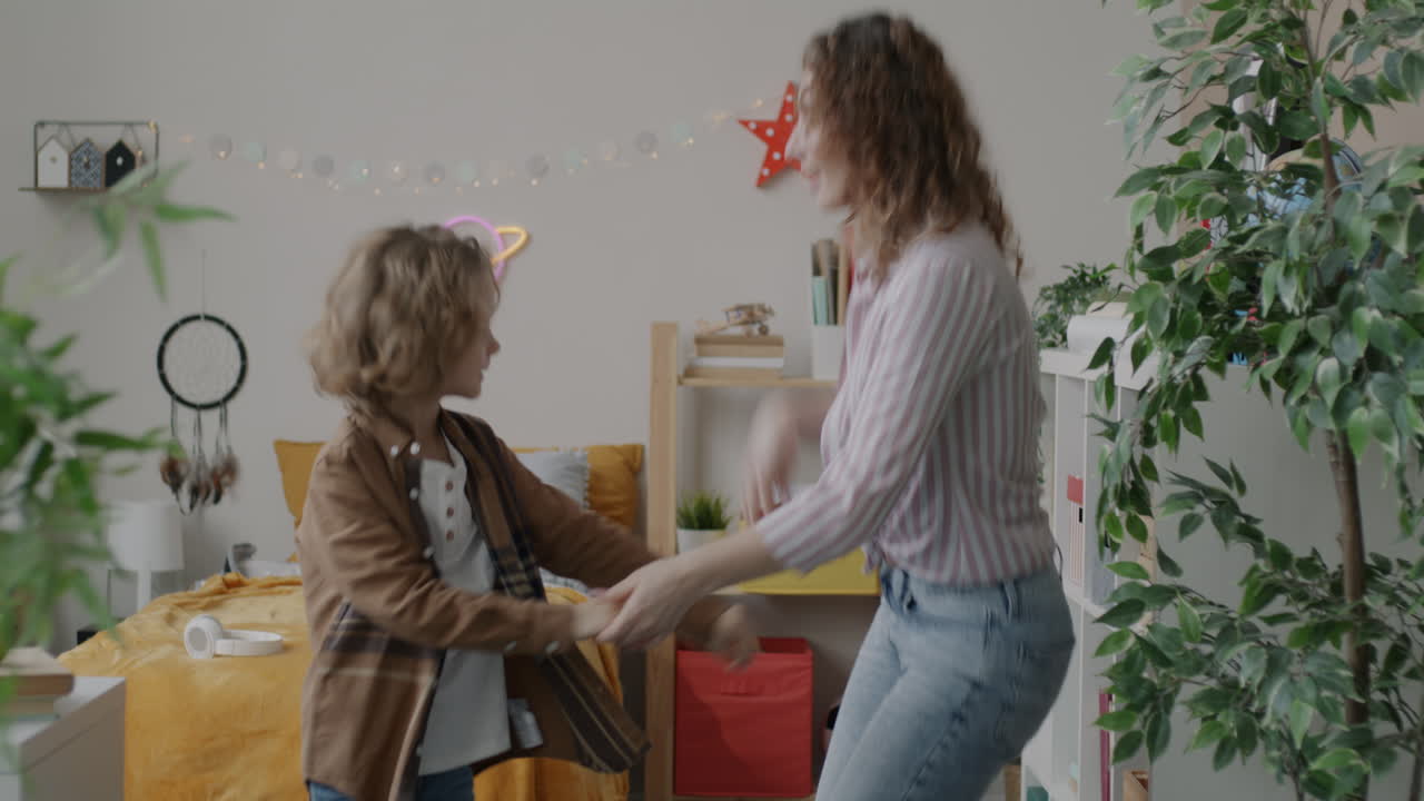 Mother and Son Dancing in a Room
