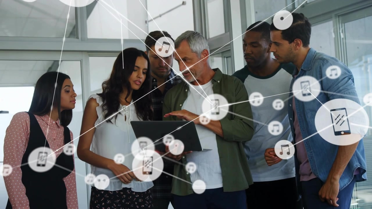 Vertical video: Lead tapping laptop, team leaning, network icons spreading over team for business