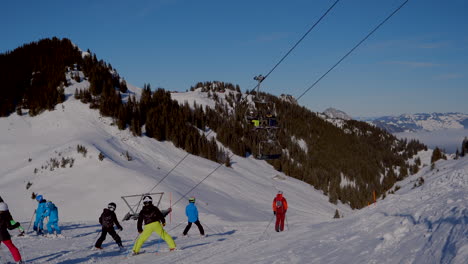 ski area in the swiss alps with people and chairlifts in the winter ski area of beckenried