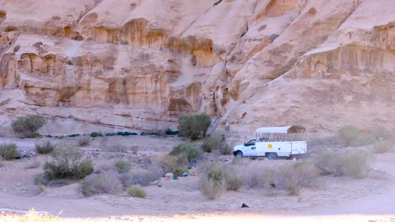 Four wheel drive tour track driving through rough, rugged mountainous desert terrain on the outskirts of the ancient city of Petra in Jordan