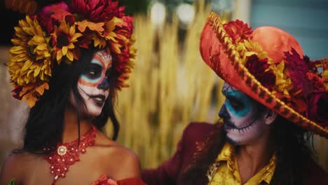 day of the dead couple in mariachi costumes