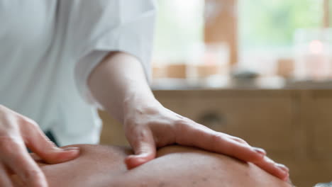 client getting a back massage