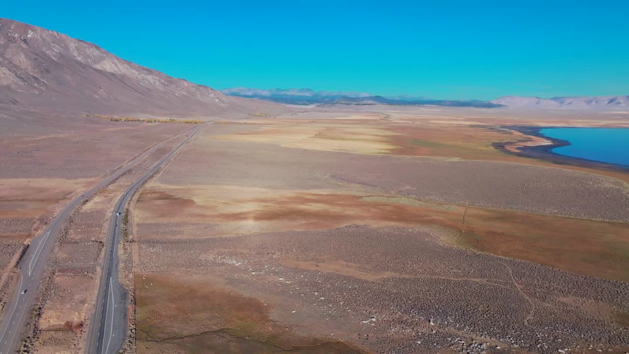 October Fall autumn Lake Crowley highway road to Mammoth Lakes Mountain California aerial drone Minarets morning blue sky Bishop Toms Place Sierra Mountains Whitmore Hilltop Hotsprings forward pan up