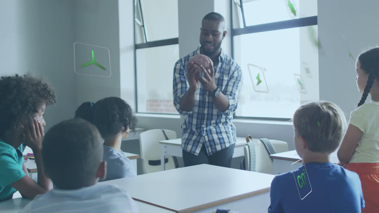 Vertical video: Picking up football, teacher in plaid teaching students in class with green icons