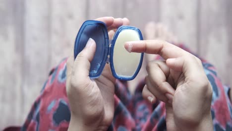 applying cream or lotion to hands and feet