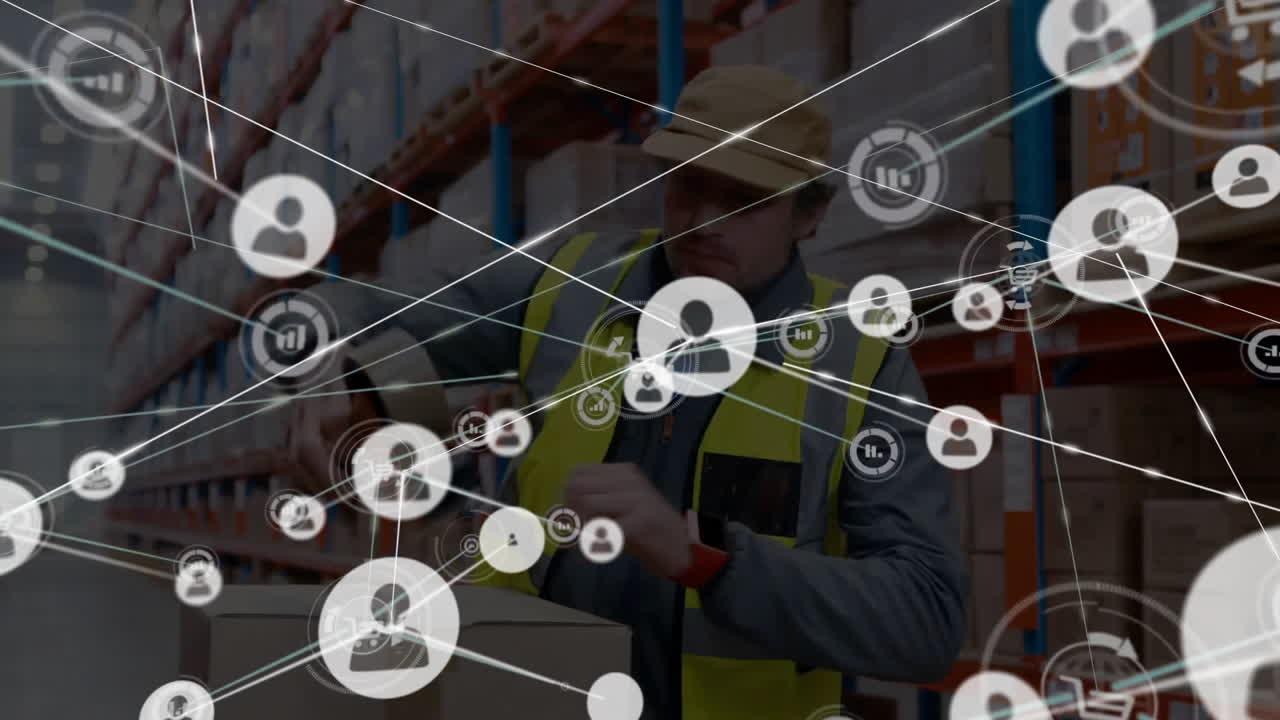 animación de iconos conectados sobre trabajadores caucásicos grabando cajas de cartón en el almacén