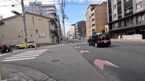 vehicles and pedestrians at a busy intersection