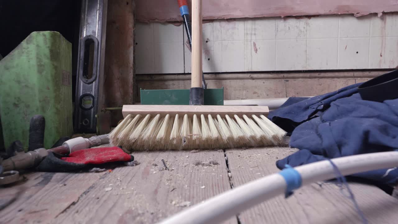 Bathroom renovation; push in on DIY tools across stripped back room during daytime