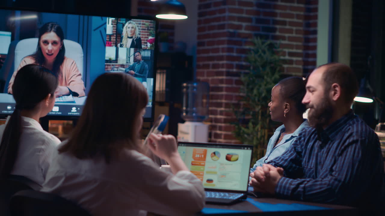 Employees planning strategy with remote team in videoconference