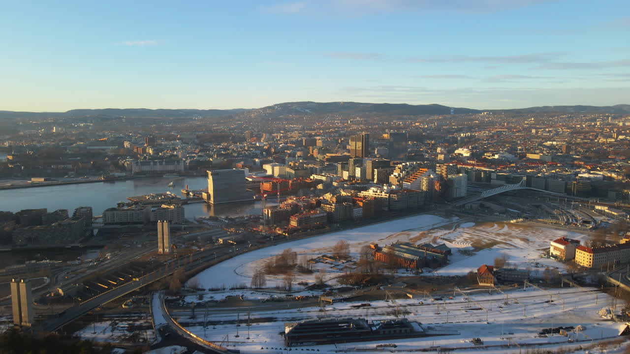 Drone shot of Oslo, Norway where we look down to the downtown and the city center on a bright sunny day