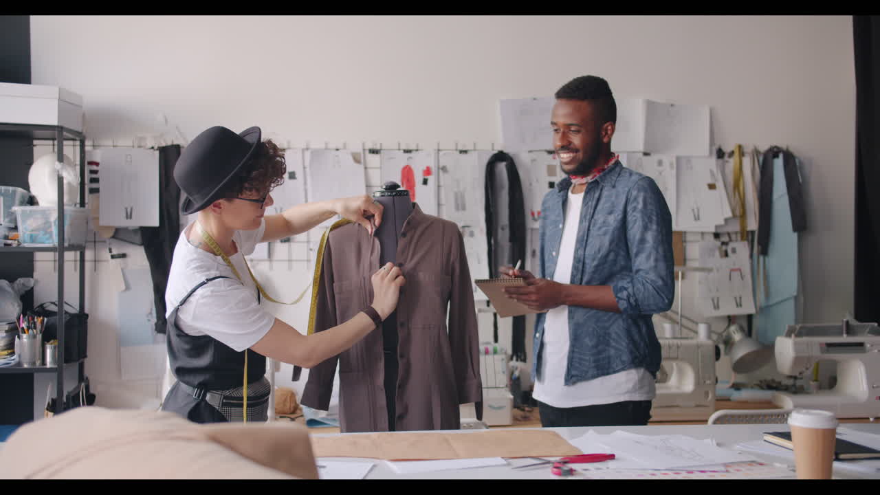 Fashion Designers Working on a New Dress Design in the Studio