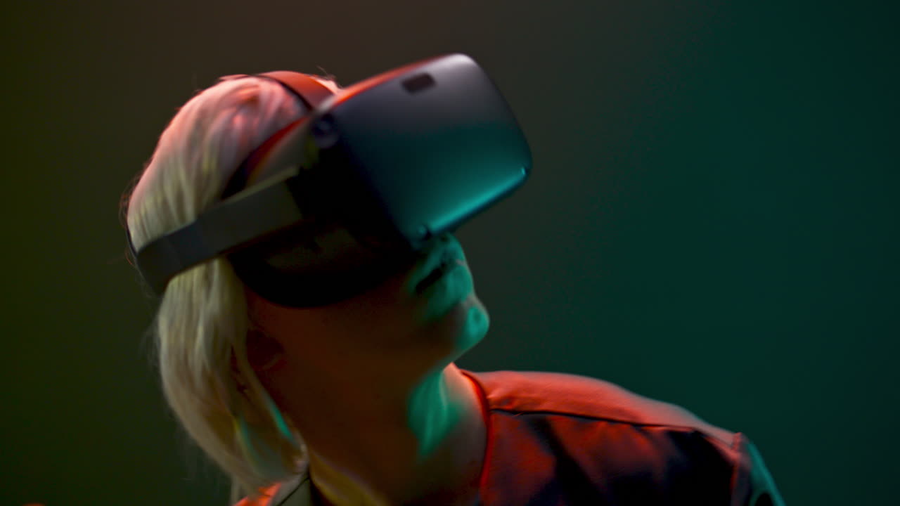 Closeup esport gamer dancing metaverse. Millennial man relaxing with 3d headset