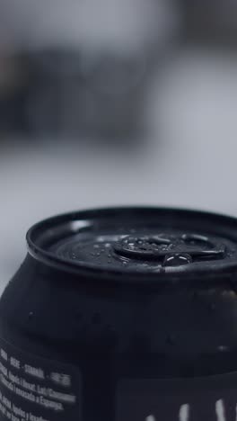 close-up of a cold, wet beverage can with condensation