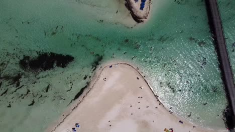 Aerial-drone-view-over-the-people-walking-along