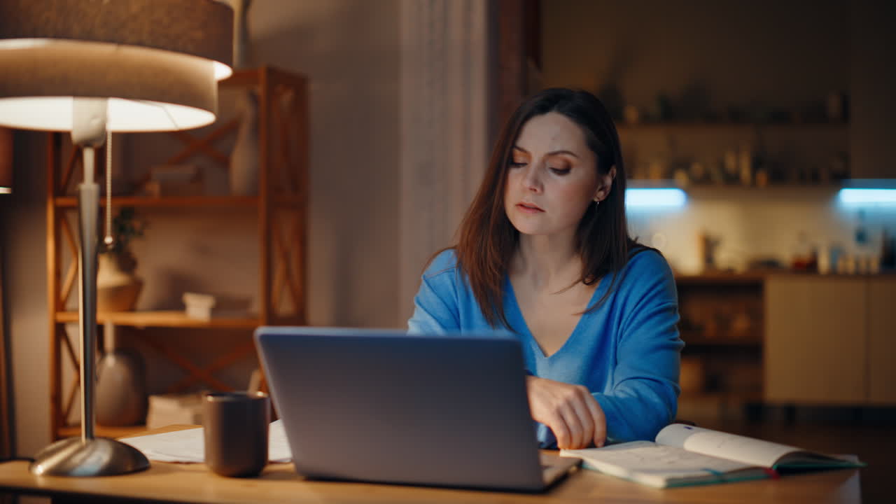 Busy startuper tired work looking laptop in lamp light closeup. Fatigued woman
