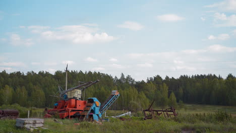 Old-agricultural-machines-parts-at-summer-countryside