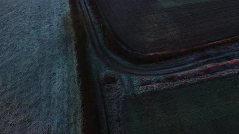 farmers track on a frosty cold winters morning in the english countryside in the uk