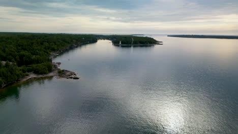 aerial view of a lighthouse on a lake island