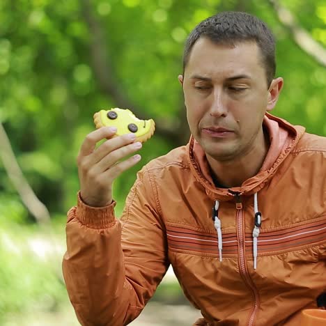man completely eating cookies