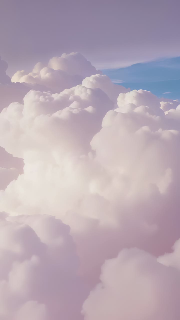 Vertical video: Drifting view panning cumulus bank aloft with ridges, warm light widening blue band
