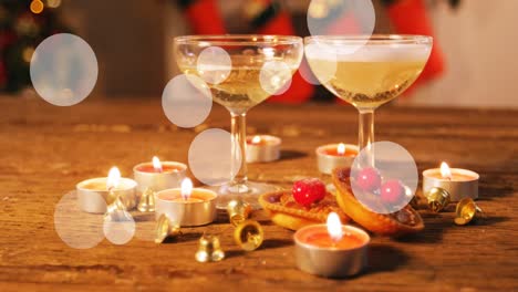 Animation-of-spots-at-christmas-and-glasses-of-champagne