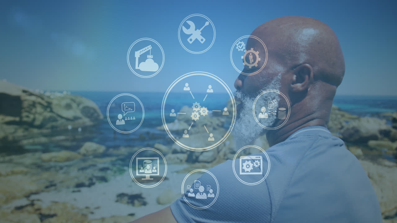 Animation of media icons over smiling senior african american man at beach
