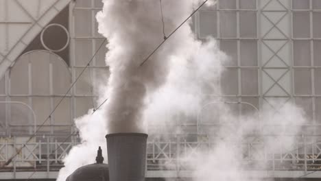 steam pipe of steam locomotive of railway. factory pipe of steam locomotive.