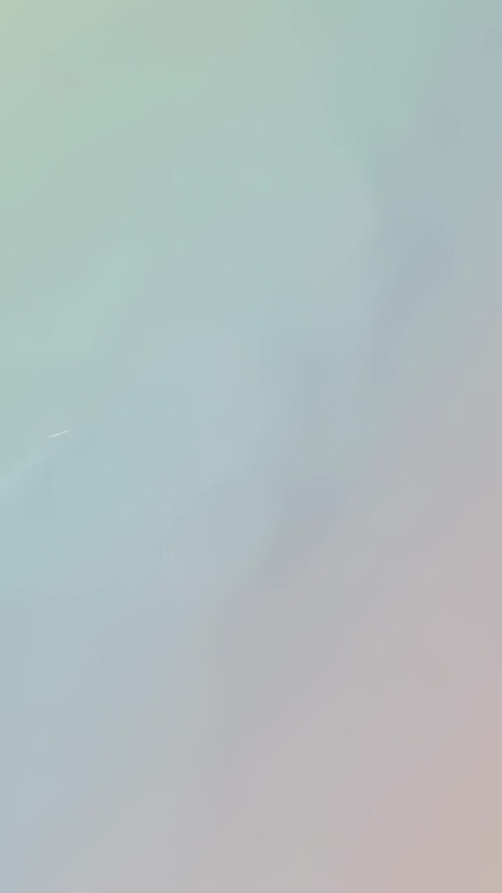 Vertical video: Shifting pastel wash during five frames on backdrop, showing faint diagonal band