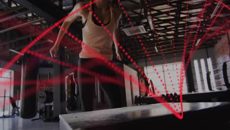 animación de cadena de adn sobre mujer caucásica haciendo ejercicio en el gimnasio de boxeo