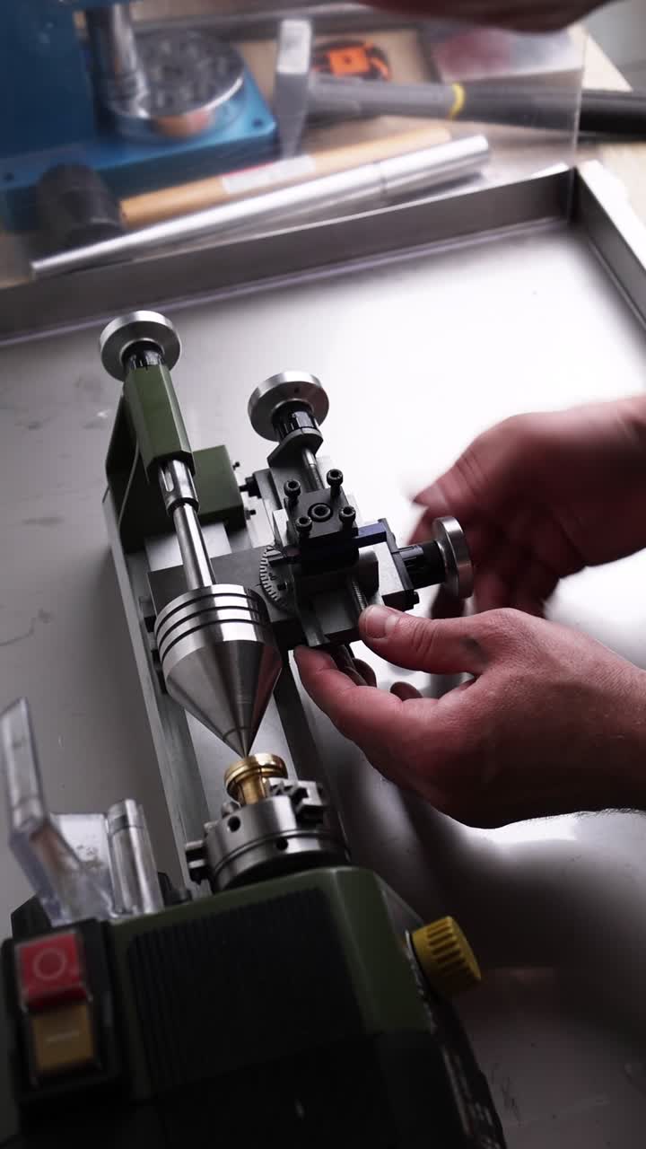 Close-up of Hands Operating a Lathe to Craft a Ring