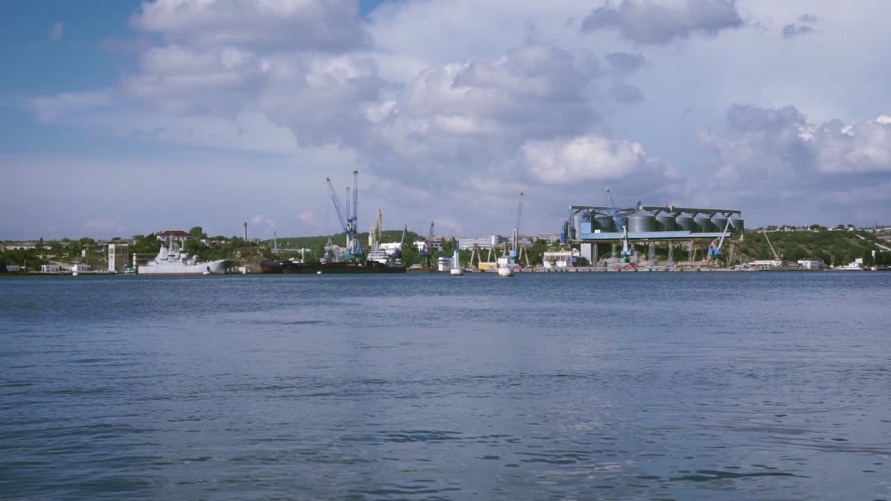 Port Scene with Grain Silos and Rusty Pier