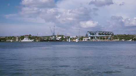 port scene with grain silos and rusty pier