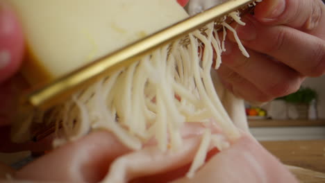 grating cheese over ham