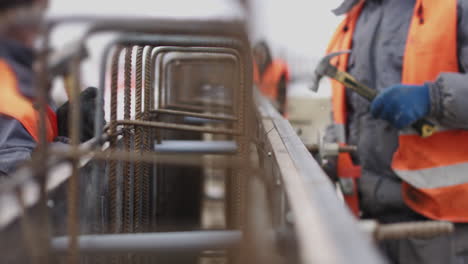 construction workers reinforcing concrete structure