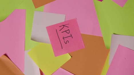 business concept of revolving sticky notes with kpis written on top note