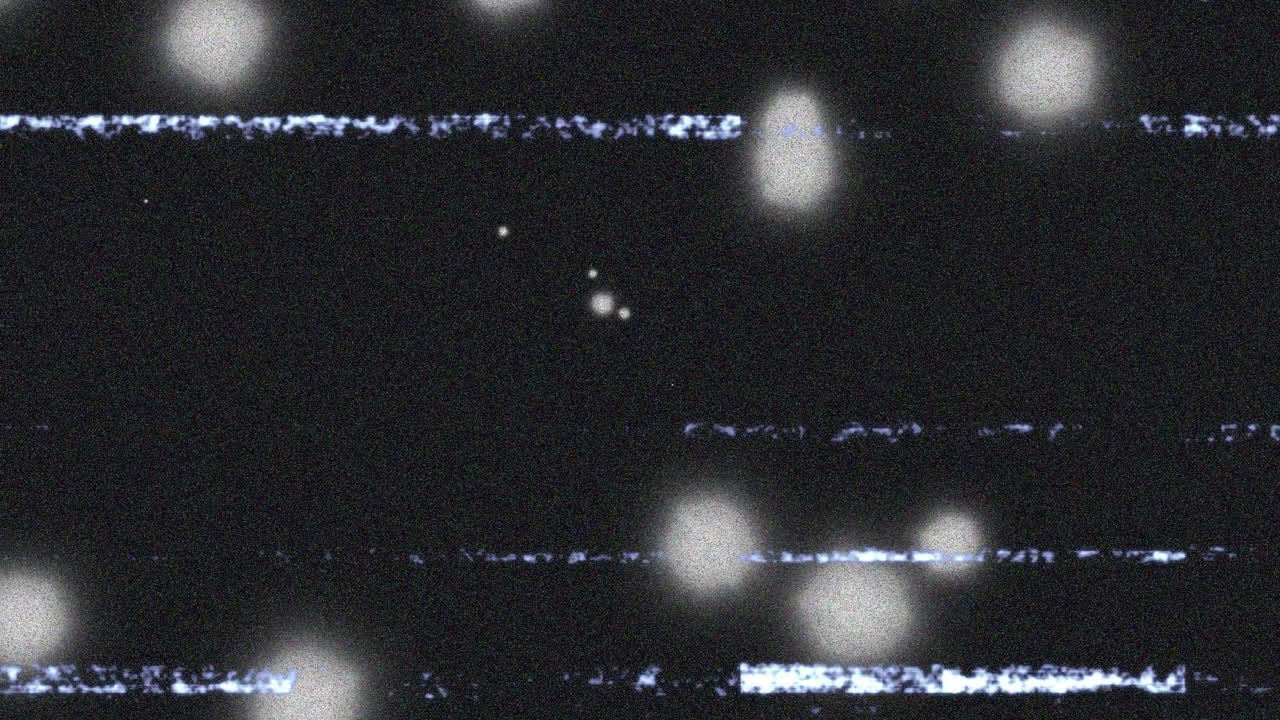 animación de la interferencia sobre las manchas brillantes sobre fondo negro