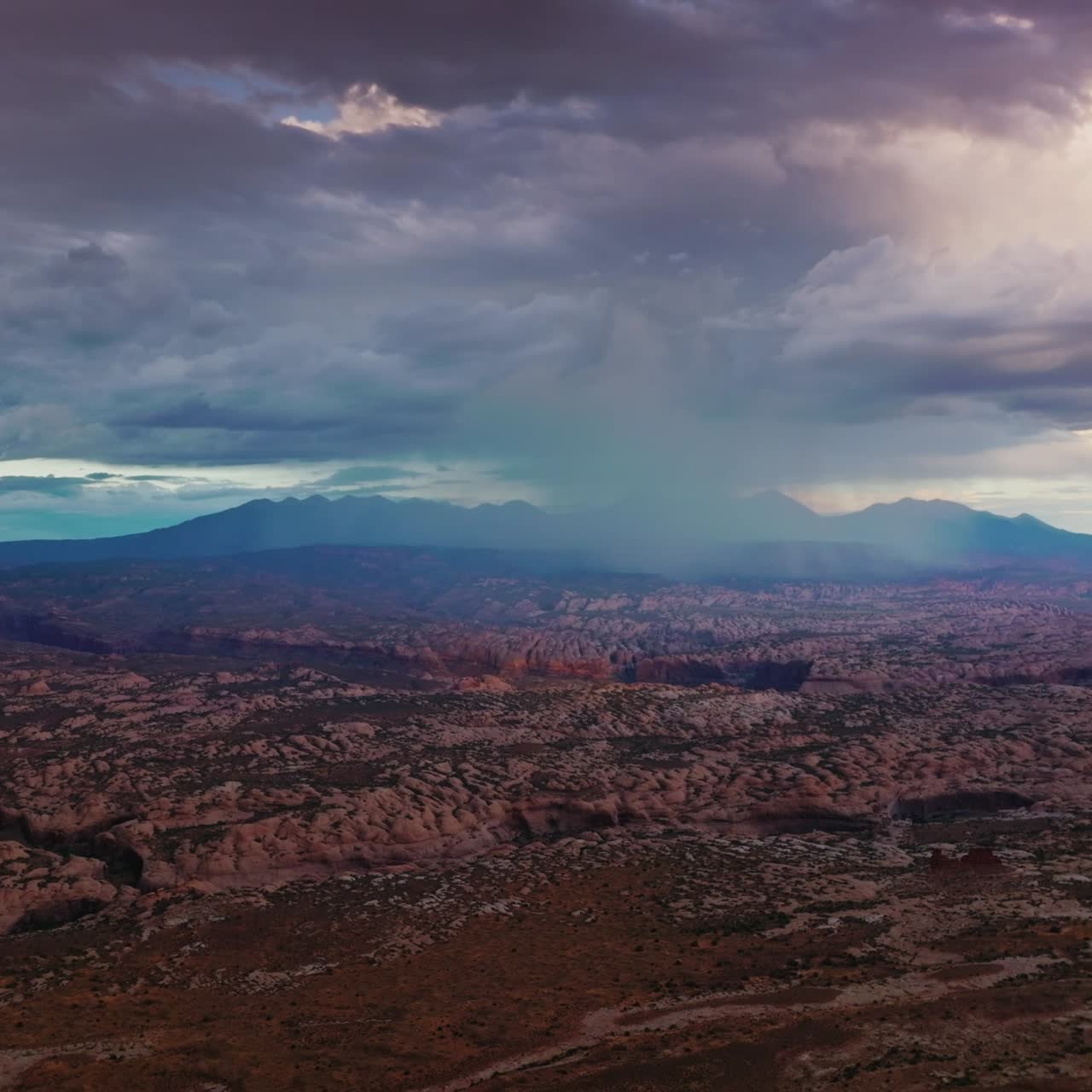 Fantastic scenic view of Zion national park in Utah, USA. Cumulus dramatic clouds accumulating over the rocks. Aerial view