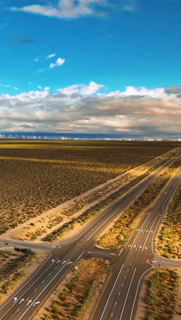 amazing view of the deserted landscape shaded by the clouds. mountains at backdrop. drone rising over the highways in nevada, usa. vertical video