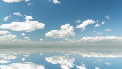 futuristic background consisting of time lapse clip of white fluffy clouds over blue sky and their reflection, video loop