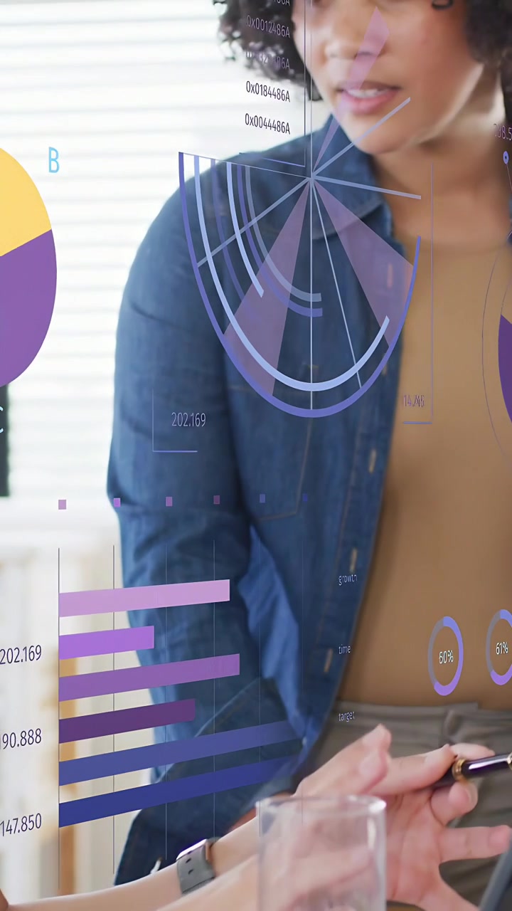 Vertical video: Standing analyst reaching for offered pen, using data overlays for business plan