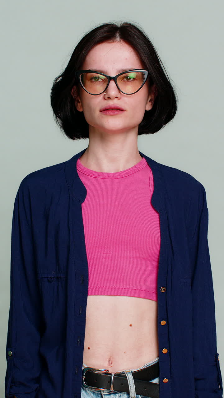 Woman shrugging shoulders scratching head confused uncertain expression not knowing puzzled mood