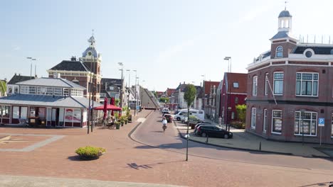 dutch town with canal bridge and cafe