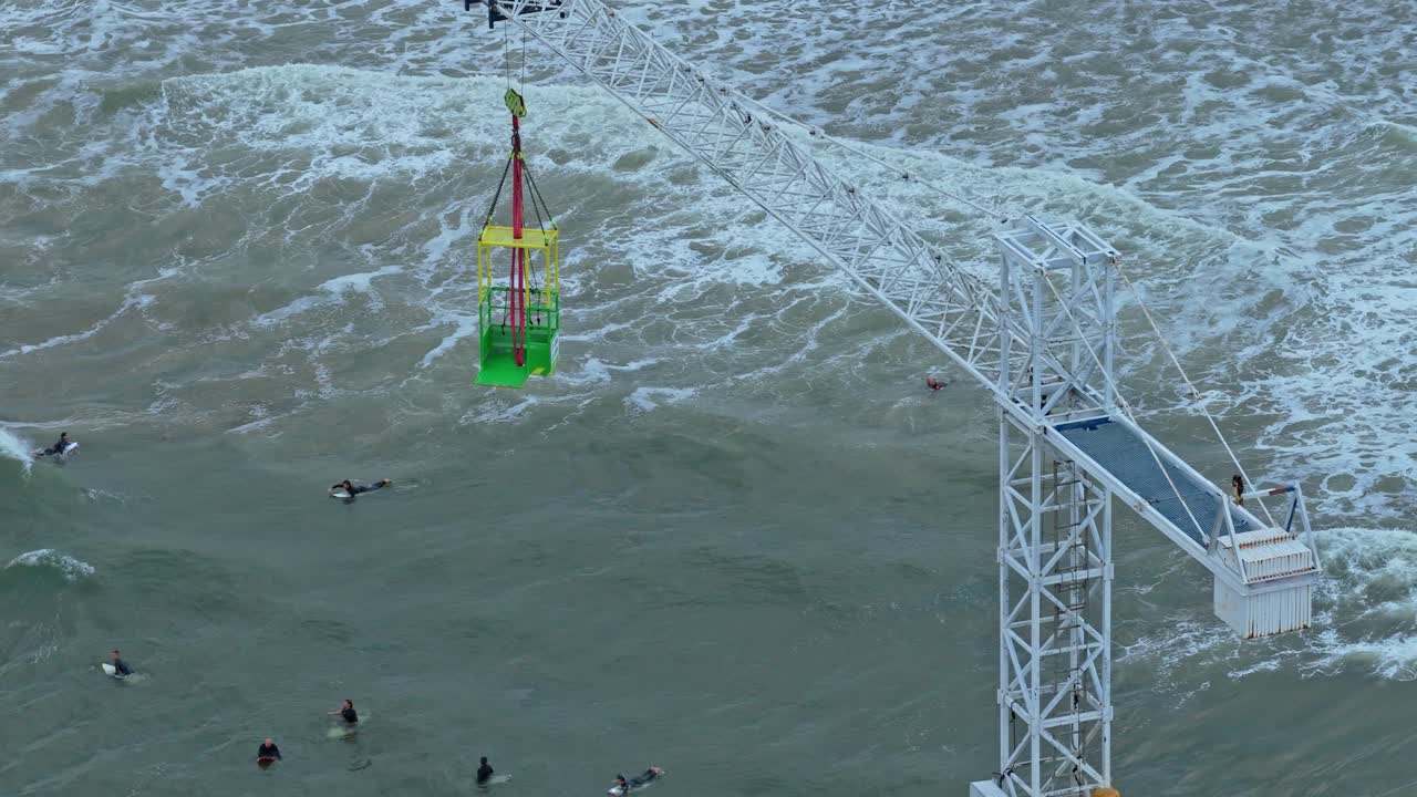 Golden hour drone view of Scheveningen Pier, Ferris wheel and sea glow, Netherlands