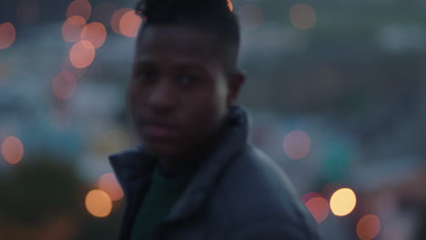 funny portrait attractive african american man drinking alcohol on rooftop smiling confidently enjoying successful lifestyle in urban city at sunset