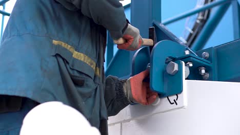 industrial worker performing maintenance on metal structure