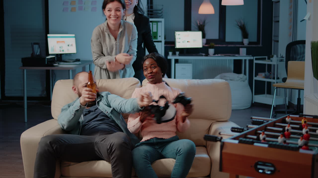 Multi ethnic people cheering while woman winning game