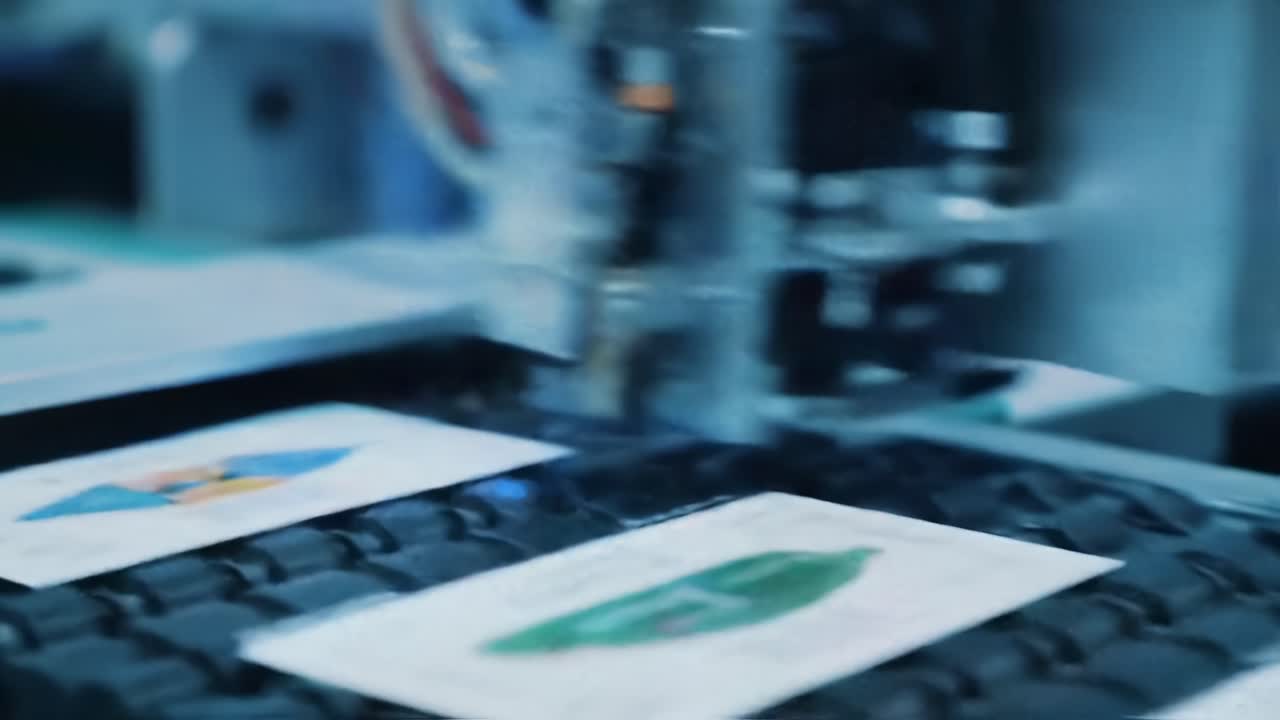 Advanced Printing Technology in Action: A Close-Up on Precision Machinery Operating on Various Print Designs in a Modern Production Environment
