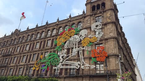 skeleton art on building on zócalo square at day of the dead celebration