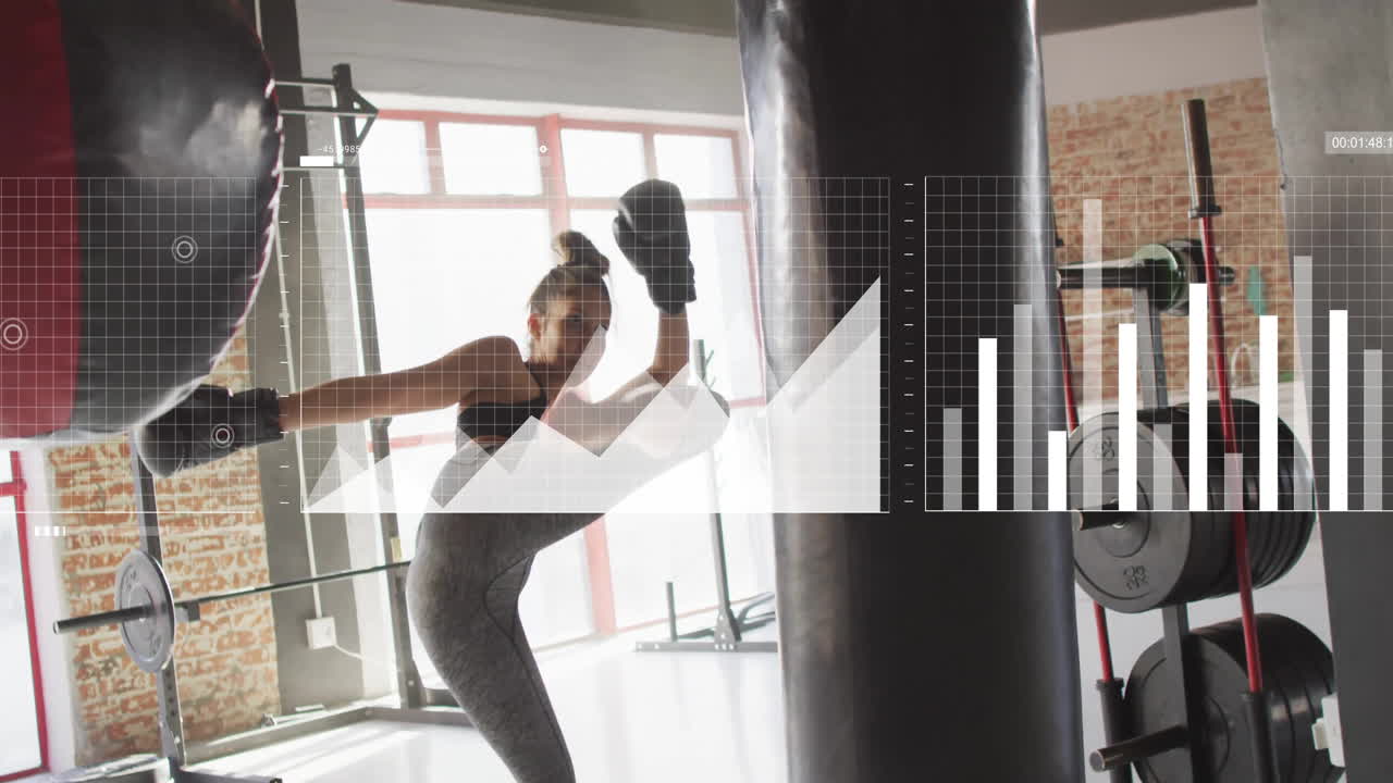 Practicing high kick on punching bag, woman with animation data overlay