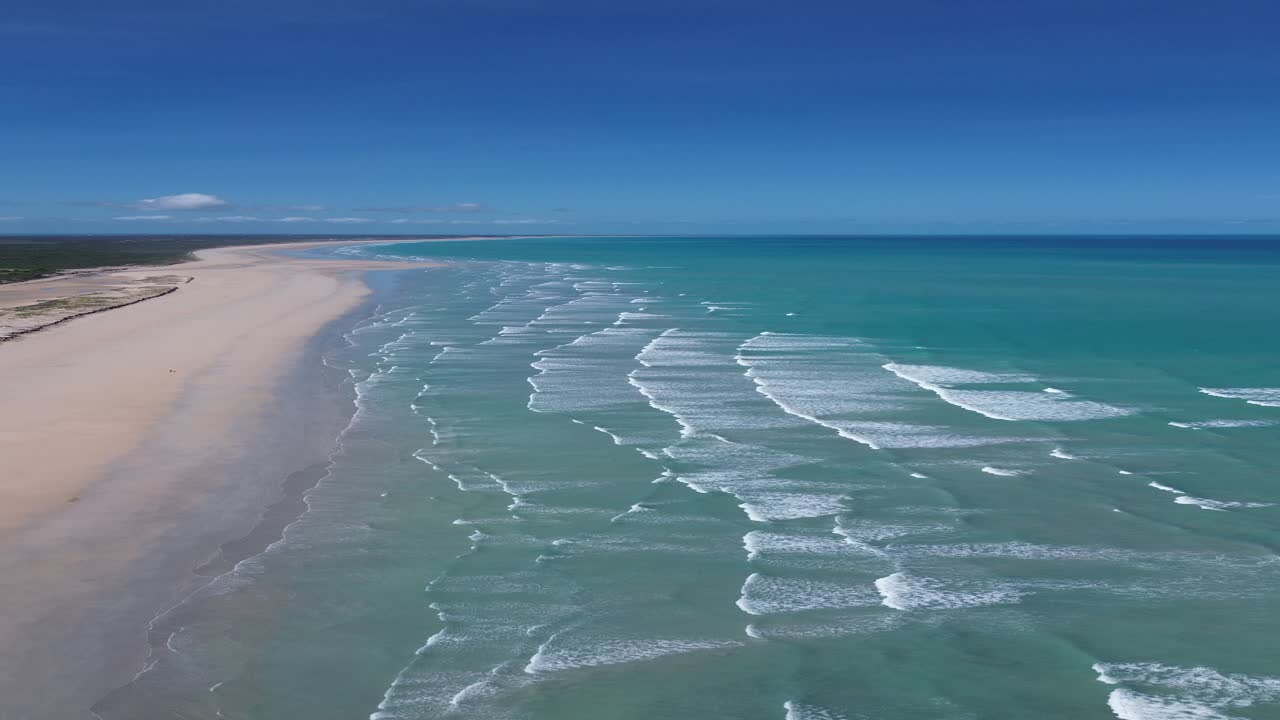 Cinematic aerial view of Coconut Wells beach near Broome, Australia. Waves and coastline seen from above.
